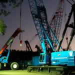 Rough terrain crane helping build 450t crawler crane