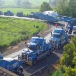 A custom fabricated beamset suspended between high capacity modular trailers is the only way to transport heavy loads.