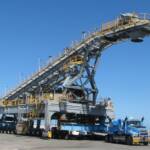 Relocating a shiploader at a port for a coal export facility requires heavy jacking, skating and transport.